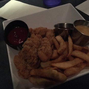 Studio Movie Grill - Chicken Tender basket with regular fries and honey BBQ sauce on side. Delicious! - Cinema Near Me - Dallas, Texas