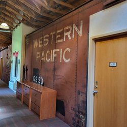 Northern Rail Traincar Inn - Authentic railcars connected by a hallway reminiscent of railroad yards and train stations.