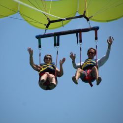 Sun Dogs Parasailing - Double Parasailing Ride waving HI on their way in for a landing!
