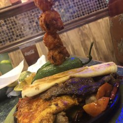 Las Palmas - The custom art work throughout the building is amazing.  There is one that resembles the owner and the food and staff is great.