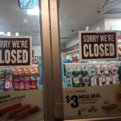7-Eleven - Open from 5:00 a.m. until open which is whenever the hell they feel like it notice no number mentioned so shop at your own risk