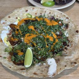 Pork Al Pastor Gringa (front), Suadero Tacos (back) Pork Al Pastor Gringa (front), Suadero Tacos (back)