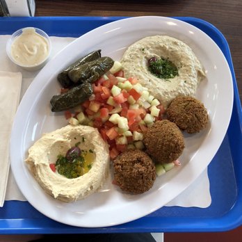 Gyro Station - Combo Mediterranean platter with falafel, dolma, baba ganoush, salad, hummus. Tzatziki sauce on the side. - Middle Eastern Near Me - Kent, Washington Gyro Station - Combo Mediterranean platter with falafel, dolma, baba ganoush, salad, hummus. Tzatziki sauce on the side. - Middle Eastern Near Me - Kent, Washington