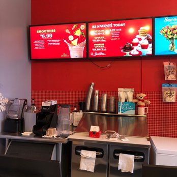 Edible Arrangements - a restaurant counter with a menu on the wall - Gift Shops Near Me - Astoria, New York Edible Arrangements - a restaurant counter with a menu on the wall - Gift Shops Near Me - Astoria, New York