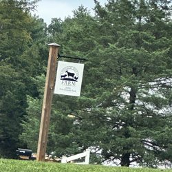 Snuggle Butts Farm - Small sign by driveway