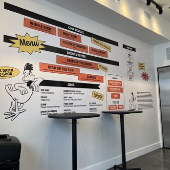 Soulfly Chicken - Cute stand up tables with wall art - Southern Near Me - Miami, Florida