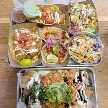 Seasurf Fish Co - Top: Fish tacos, chicken tinga taco (bottom middle), roasted sweet potato taco (top right), seasurf slaw Bottom: Chicken black bean nachos - Seafood Near Me - Del Mar, California Seasurf Fish Co - Top: Fish tacos, chicken tinga taco (bottom middle), roasted sweet potato taco (top right), seasurf slaw Bottom: Chicken black bean nachos - Seafood Near Me - Del Mar, California