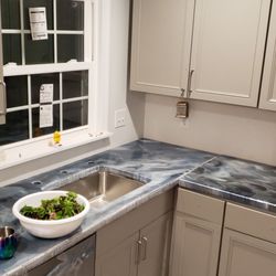 Elite Concepts - Custom concrete counter tops coated in metallic epoxy!