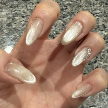 Wedo Nail Salon - Cat Eye design with a little gemstones for added sparkle! - Permanent Makeup Near Me - Las Vegas, Nevada Wedo Nail Salon - Cat Eye design with a little gemstones for added sparkle! - Permanent Makeup Near Me - Las Vegas, Nevada