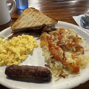 Nick’s Breakfast & Coffee - My $9.99 Breakfast plate. One egg, one bacon, one sausage, hash browns and two toast. Served at this price till 11am. - Breakfast & Brunch Near Me - Leander, Texas Nick’s Breakfast & Coffee - My $9.99 Breakfast plate. One egg, one bacon, one sausage, hash browns and two toast. Served at this price till 11am. - Breakfast & Brunch Near Me - Leander, Texas
