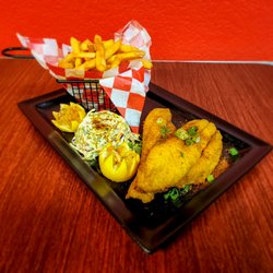 Pho King Wing - A fried catfish fillet dinner with an in-house
made coleslaw and refreshing lemon with a basket of fries.