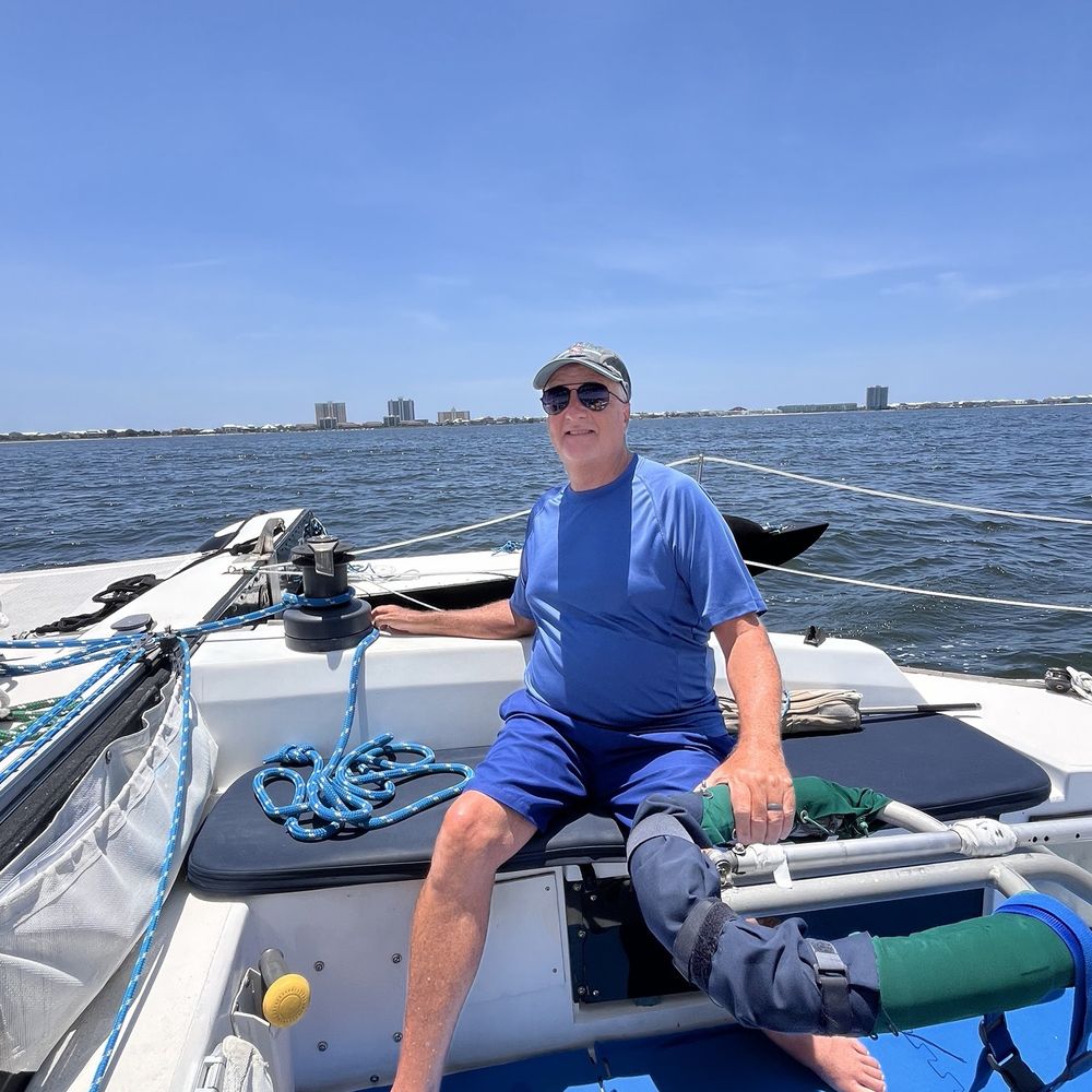 Condor Sailing Adventures - Tom takes his turn at the tiller. - Boating Near Me - Pensacola Beach, Florida Condor Sailing Adventures - Tom takes his turn at the tiller. - Boating Near Me - Pensacola Beach, Florida