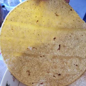 La Jarochita Tortilleria - person holding a tortilla - Mexican Near Me - Perris, California La Jarochita Tortilleria - person holding a tortilla - Mexican Near Me - Perris, California