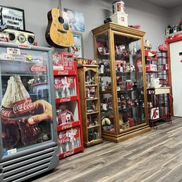 Front entrance, narrow walk way, but super old school classic Coca Cola theme.