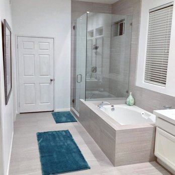 Youngs Construction - a large bathroom with a walk in shower - General Contractors Near Me - Coachella, California Youngs Construction - a large bathroom with a walk in shower - General Contractors Near Me - Coachella, California