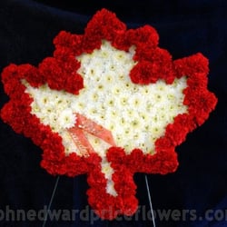 John Edward Price Flowers & Gifts - We made this custom maple leaf arrangement for a Canadian man's memorial service.