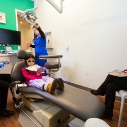 Montgomery Pediatric Dentistry - Dr. Ciano of Montgomery Pediatric Dentistry explains a dental procedure to her pediatric patient