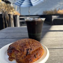 Belle Epicurean Bakery - Cold brew with a ham and cheese croissant