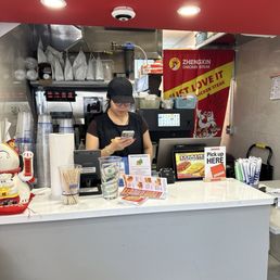 Unprofessional girl always on her phone, not cleaning the place while laughing at her customers Unprofessional girl always on her phone, not cleaning the place while laughing at her customers