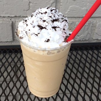 Oasis Coffee House - a cup of iced coffee with whipped cream and chocolate sprinkles - Coffee & Tea Near Me - Montezuma, Georgia Oasis Coffee House - a cup of iced coffee with whipped cream and chocolate sprinkles - Coffee & Tea Near Me - Montezuma, Georgia