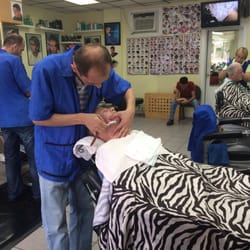 My Hairstylists Barbershop - Mike doing a hot towel shave