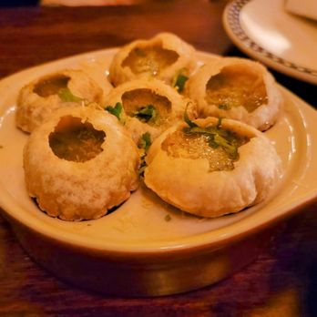 The Drunken Munkey - UES - a plate of food and a glass of wine - Indian Near Me - New York, New York The Drunken Munkey - UES - a plate of food and a glass of wine - Indian Near Me - New York, New York