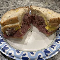 The Yummy! Corned Beef, pastrami, cheese, mustard on fresh rye... The Yummy! Corned Beef, pastrami, cheese, mustard on fresh rye...