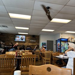 73 Grill - Inside decor is simple and traditional to a roadside diner but tasteful and clean .