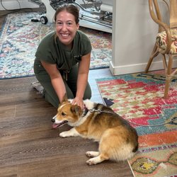 Magnolia Tribe Chiropractic - Dr. Lana loving on a tribe members fur baby.