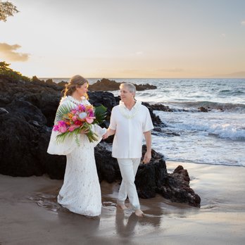 Behind The Lens Maui - Nicole captured the movement of the waves and the contrast of the dark lava rock against our wedding attire. - Photographers Near Me - Wailuku, Hawaii Behind The Lens Maui - Nicole captured the movement of the waves and the contrast of the dark lava rock against our wedding attire. - Photographers Near Me - Wailuku, Hawaii