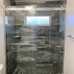 Mann Tile - Line drain, pebble floor, Schluter edging