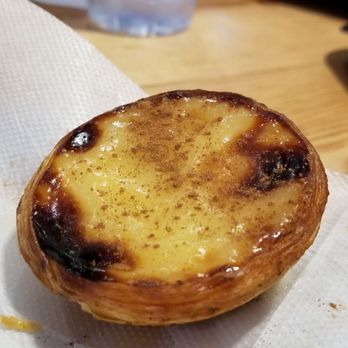 Time Out Market - Warm pastel de nata, a traditional Portuguese dessert. - Public Markets Near Me - Lisbon, 11 Time Out Market - Warm pastel de nata, a traditional Portuguese dessert. - Public Markets Near Me - Lisbon, 11