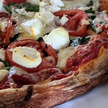 Dino's Pizza - Detail of the spinach lasagna pizza - Pizza Near Me - Burbank, California