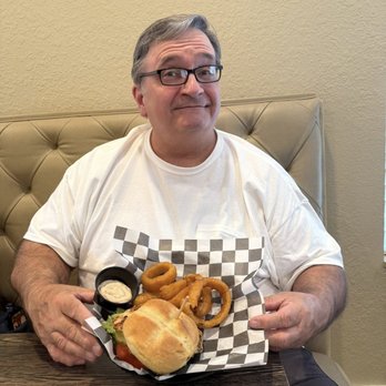 Tavern At The Glen - Chicken Sandwich and Onion Rings - American Near Me - Ocala, Florida Tavern At The Glen - Chicken Sandwich and Onion Rings - American Near Me - Ocala, Florida