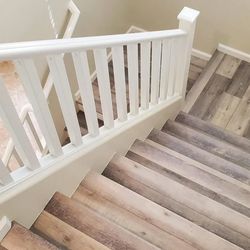 Abel Carpet Tile And Wood - Luxury vinyl plank on stairs with white risers
