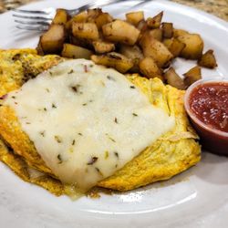 Apple Barrel Cafe - Custom omelet - 3 eggs, chorizo & jalapeños with jack cheese. Home fries & a side of biscuits and gravy off in the distance.