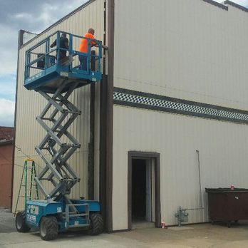 3 Generations Drywall - a man standing on a lift outside of a building - Drywall Installation & Repair Near Me 3 Generations Drywall - a man standing on a lift outside of a building - Drywall Installation & Repair Near Me