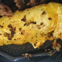 Despite the zoomed in appearance, many ingredients were lacking both in and outside of the omelet.