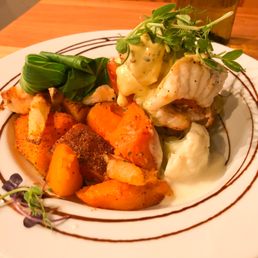 Monkfish and Salmon Stack. New Zealand monkfish & hot smoked salmon, parmesan potato cake, bok choy, seasonal vegetables, béarnaise sauce.