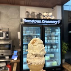 Hometown Creamery - Vanilla peanut butter & chocolate covered strawberry ice cream on a cone