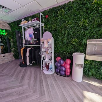Higher Ground Fitness - Merch wall - Pilates Near Me - Newton, Massachusetts Higher Ground Fitness - Merch wall - Pilates Near Me - Newton, Massachusetts