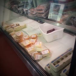 Jones Processing - Cheeses, jerky, & packaged meats in the front showcase.