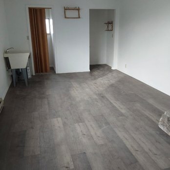 CM Home Improvement - empty living room with hardwood floors - General Contractors Near Me CM Home Improvement - empty living room with hardwood floors - General Contractors Near Me
