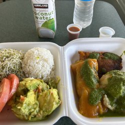 Fela's - Left-Alfalfa sprouts, tomatoes, white rice and avocado mash with papaya.  Right-Pastele de yuca, alcapurria, mashed yuca with onions.