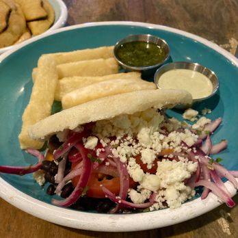 Hola Arepa - Black bean and sweet potato Arepa and yucca fries - Latin American Near Me - Minneapolis, Minnesota Hola Arepa - Black bean and sweet potato Arepa and yucca fries - Latin American Near Me - Minneapolis, Minnesota