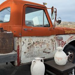 Ruby Road Vintage - Ruby's Resale vintage orange pickup truck in front called "Eager Beaver 1"