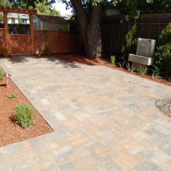 Ecology Landscape Company - New paver patio with Basalite "Positano" 12" & 6" pavers; landscaping, fountain, lighting, privacy fence with gate & arbor. - Landscaping Near Me Ecology Landscape Company - New paver patio with Basalite "Positano" 12" & 6" pavers; landscaping, fountain, lighting, privacy fence with gate & arbor. - Landscaping Near Me