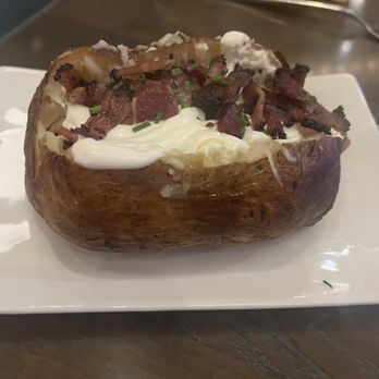Shkodé - Loaded baked potato - Steakhouses Near Me - Wayland, Michigan Shkodé - Loaded baked potato - Steakhouses Near Me - Wayland, Michigan