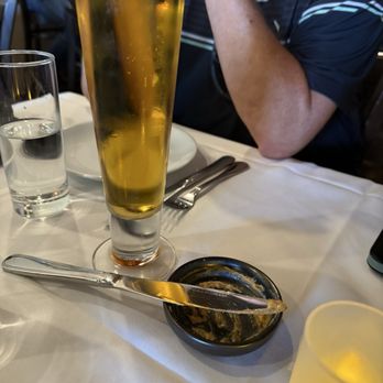 Sabor & Sazon - Draft beer and the empty container for the pace that went with our bread - Italian Near Me - Paso Robles, California