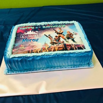 Flavian's Kitchen - a blue cake with a picture of a soldier on it - Custom Cakes Near Me